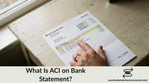 Finger pointing at an ACI entry on a bank statement