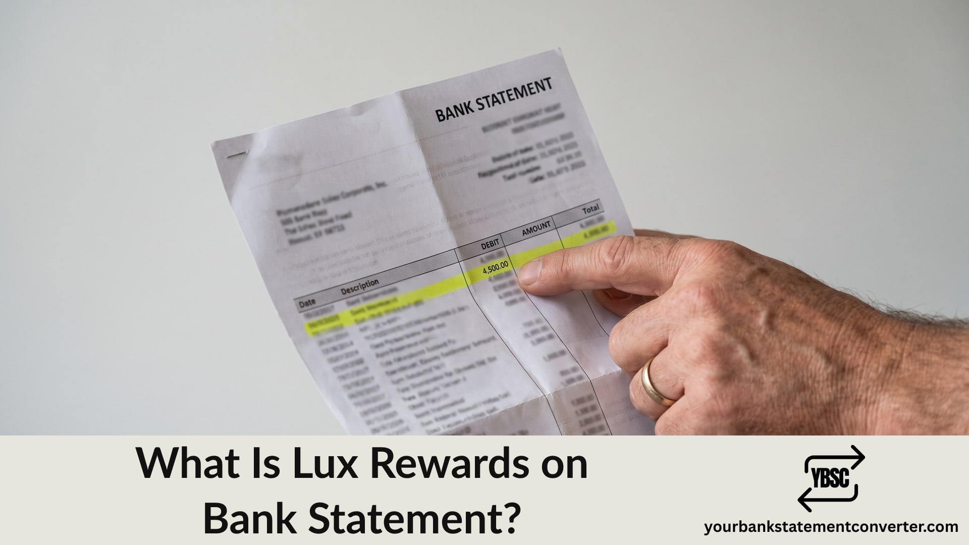 Finger pointing at a Lux Rewards entry on a bank statement