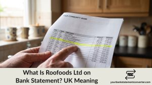 Finger pointing at a Roofoods Ltd entry highlighted on a UK bank statement