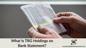 Finger pointing at a TRG Holdings entry on a bank statement
