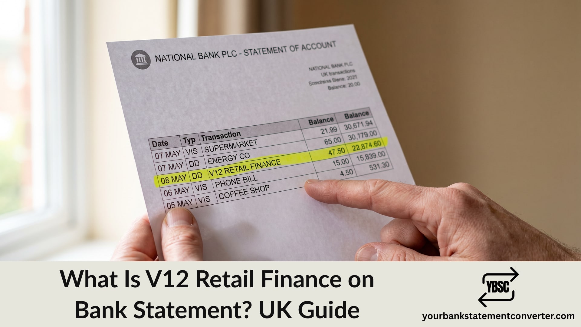 Finger pointing at a V12 Retail Finance direct debit on a bank statement